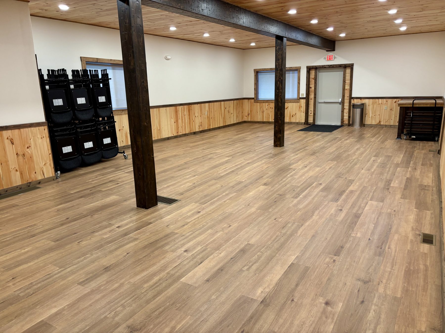 Main hall with folding chairs and open floor space